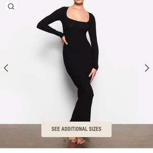 SKIMS body on black dress